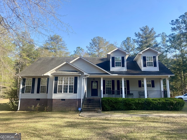 1311 Belmont Dr, Dublin, GA 31021 - view of front of home with covered porch, a front yard, crawl space, and a shingled roof