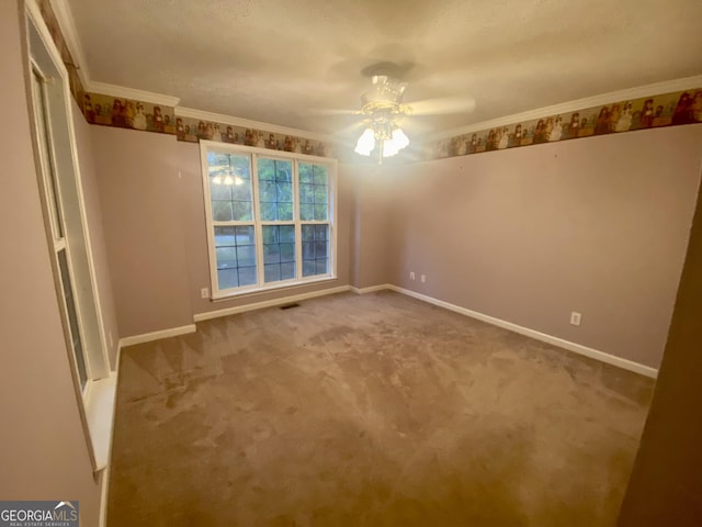 1311 Belmont Dr, Dublin, GA 31021 - unfurnished bedroom featuring a ceiling fan, crown molding, carpet, and baseboards