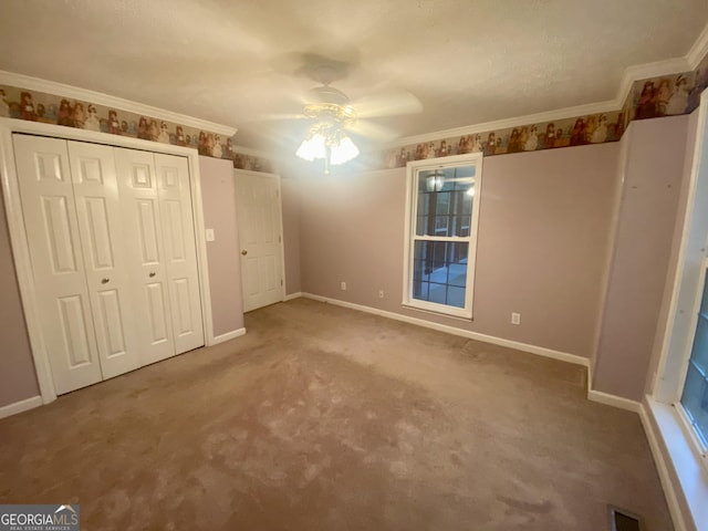 1311 Belmont Dr, Dublin, GA 31021 - unfurnished bedroom with ornamental molding, carpet, baseboards, and visible vents