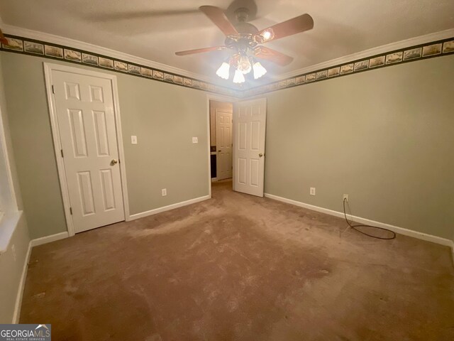 1311 Belmont Dr, Dublin, GA 31021 - unfurnished bedroom featuring baseboards, carpet floors, ornamental molding, and a ceiling fan