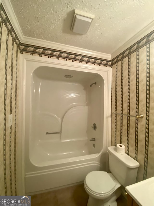 1311 Belmont Dr, Dublin, GA 31021 - bathroom featuring toilet, vanity, and a textured ceiling