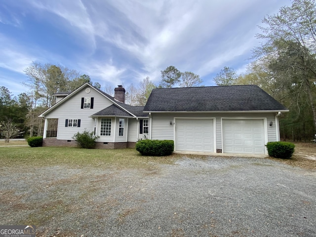 1311 Belmont Dr, Dublin, GA 31021 - view of front of house featuring driveway, crawl space, a shingled roof, and an attached garage