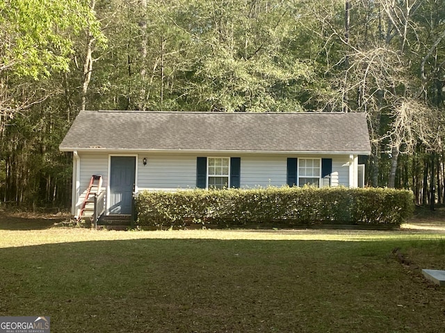 1311 Belmont Dr, Dublin, GA 31021 - ranch-style house featuring entry steps, a front lawn, and roof with shingles