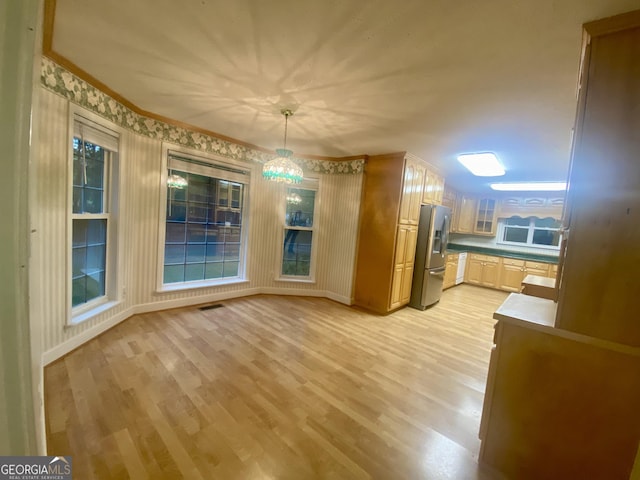 1311 Belmont Dr, Dublin, GA 31021 - unfurnished dining area featuring baseboards, visible vents, and light wood-style floors