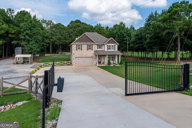 view of front of house featuring fence, an attached garage, driveway, a gate, and a front lawn