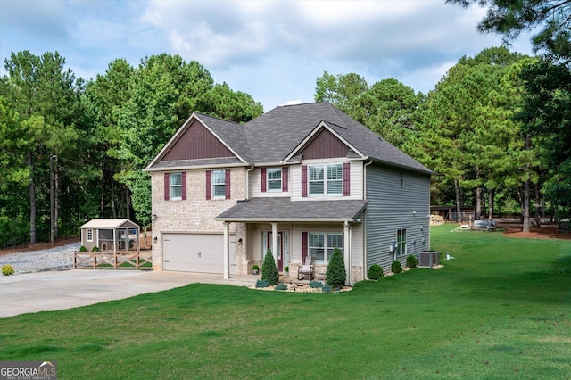 craftsman inspired home with driveway, an attached garage, cooling unit, and a front yard