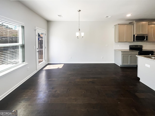 7109 Gladstone Cir, Lithonia, GA 30038 - kitchen with stainless steel appliances, dark wood-style flooring, tasteful backsplash, recessed lighting, and hanging light fixtures