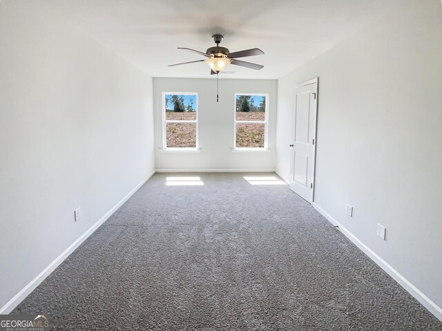 7109 Gladstone Cir, Lithonia, GA 30038 - carpeted spare room featuring ceiling fan and baseboards