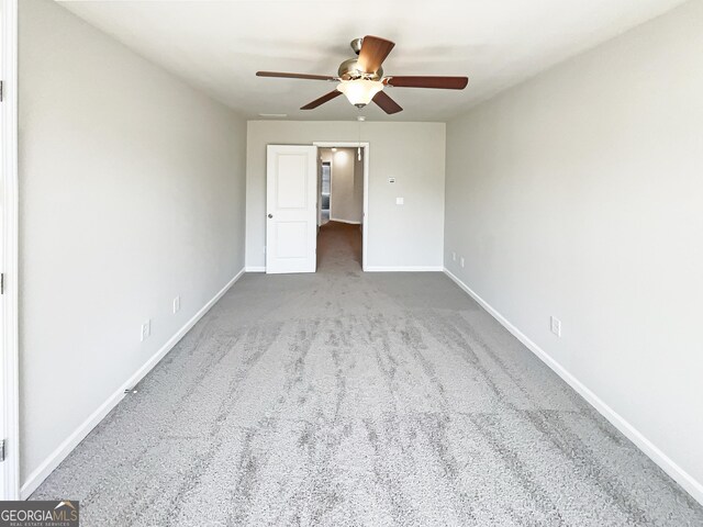 7109 Gladstone Cir, Lithonia, GA 30038 - empty room with ceiling fan and carpet flooring