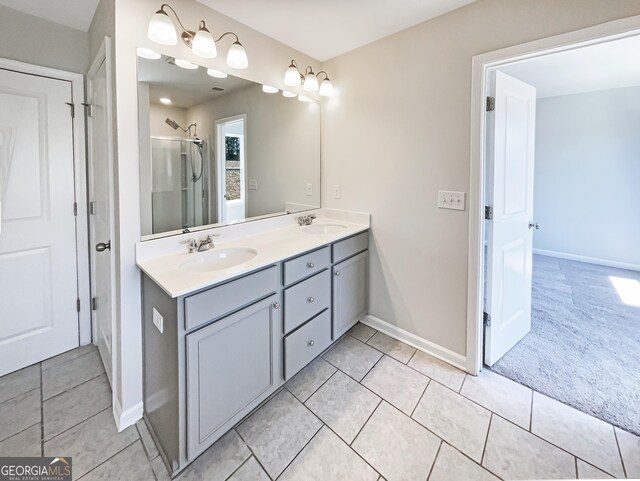 7109 Gladstone Cir, Lithonia, GA 30038 - bathroom with double vanity, an enclosed shower, and tile patterned floors