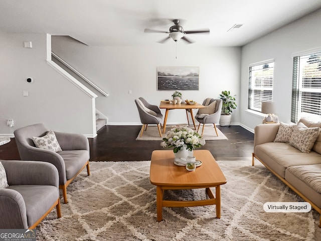 7109 Gladstone Cir, Lithonia, GA 30038 - living room featuring stairs, wood finished floors, and a ceiling fan