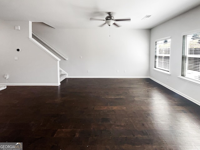 7109 Gladstone Cir, Lithonia, GA 30038 - unfurnished living room featuring stairs, a ceiling fan, and wood finished floors