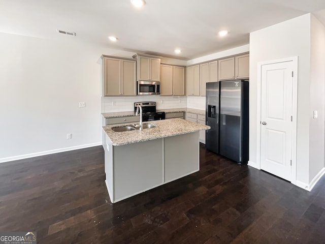 7109 Gladstone Cir, Lithonia, GA 30038 - kitchen featuring appliances with stainless steel finishes, gray cabinetry, an island with sink, dark wood-style floors, and decorative backsplash