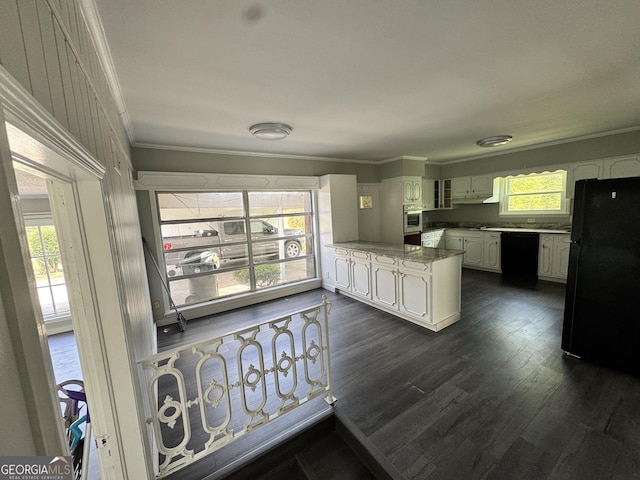 kitchen featuring a wealth of natural light, white cabinetry, black appliances, and ornamental molding