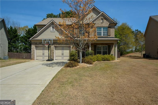 craftsman-style house with a front yard, brick siding, and driveway