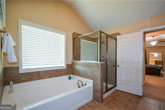full bath featuring ensuite bathroom, a bath, a shower stall, vaulted ceiling, and tile patterned flooring