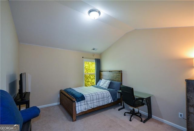 carpeted bedroom featuring visible vents, baseboards, and vaulted ceiling