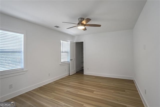2041 Briarcliff Rd NE, Atlanta, GA 30329 - empty room featuring a ceiling fan and light wood-style floors
