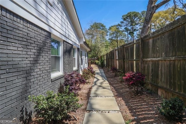 2041 Briarcliff Rd NE, Atlanta, GA 30329 - view of home's exterior featuring brick siding and a fenced backyard