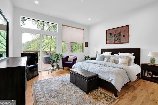 bedroom featuring light wood finished floors and recessed lighting