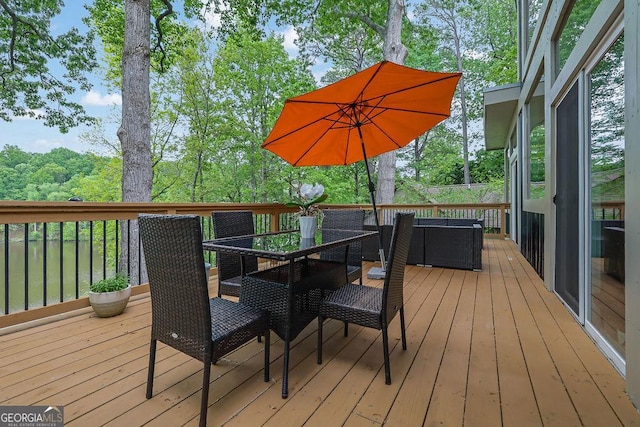 deck with outdoor dining space