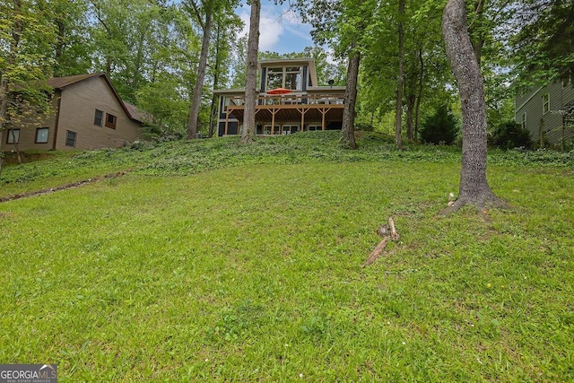 view of yard featuring a wooden deck