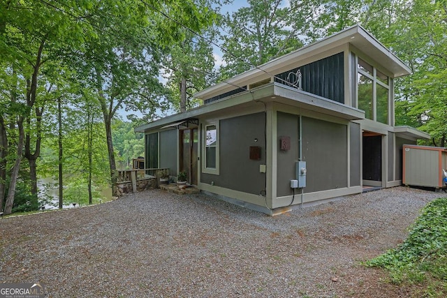 view of side of home with a sunroom
