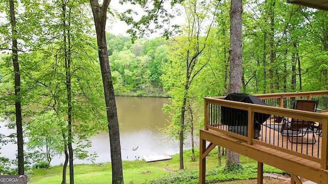 property view of water featuring a forest view