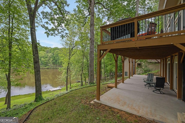 exterior space featuring a deck with water view