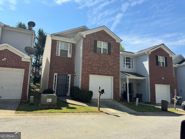 2863 Windsor Forrest Ct, Atlanta, GA 30349 - traditional home featuring concrete driveway, brick siding, and a garage