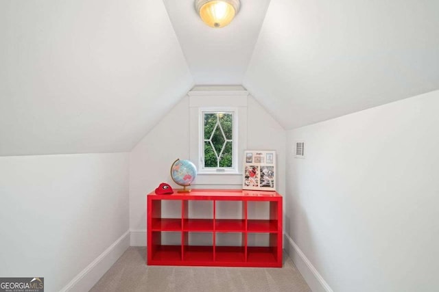playroom with baseboards, vaulted ceiling, visible vents, and carpet floors
