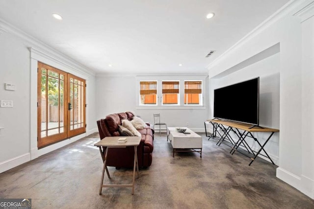 living area featuring baseboards, concrete floors, and visible vents