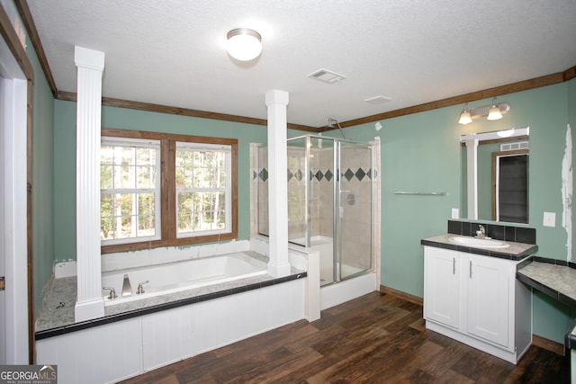 full bath with a shower stall, visible vents, ornate columns, and ornamental molding