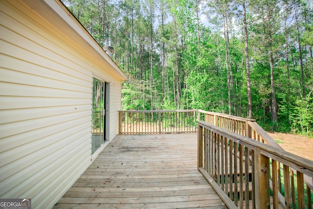 deck featuring a wooded view