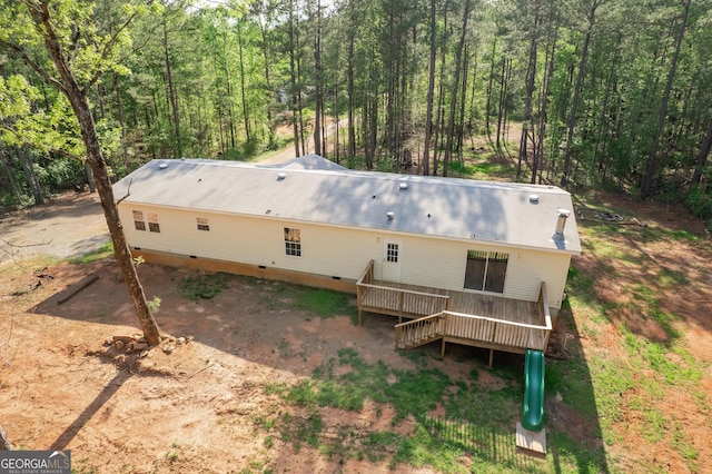 birds eye view of property featuring a wooded view