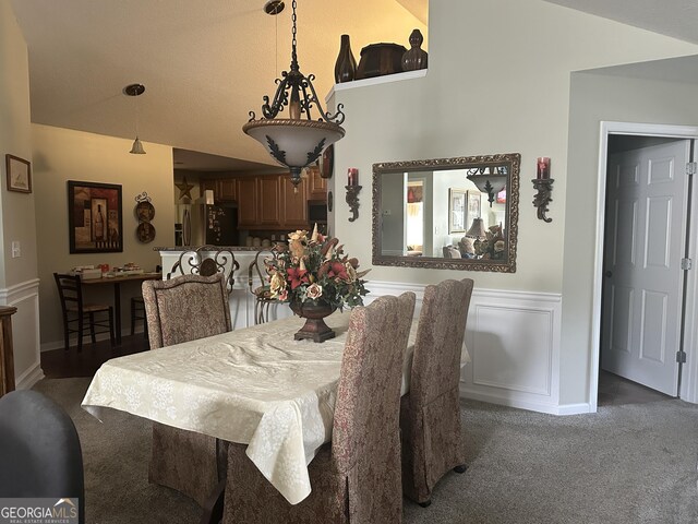 227 Fenwick Cir, Mcdonough, GA 30253 - carpeted dining room with lofted ceiling and a wainscoted wall