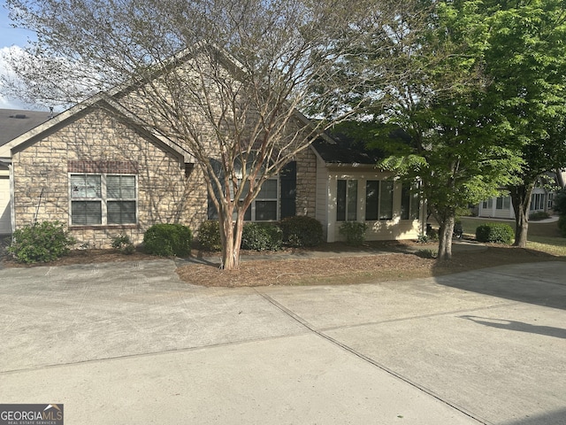 227 Fenwick Cir, Mcdonough, GA 30253 - obstructed view of property featuring stone siding