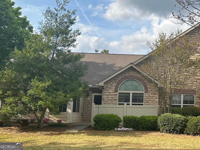 227 Fenwick Cir, Mcdonough, GA 30253 - view of front of home with stone siding and a shingled roof