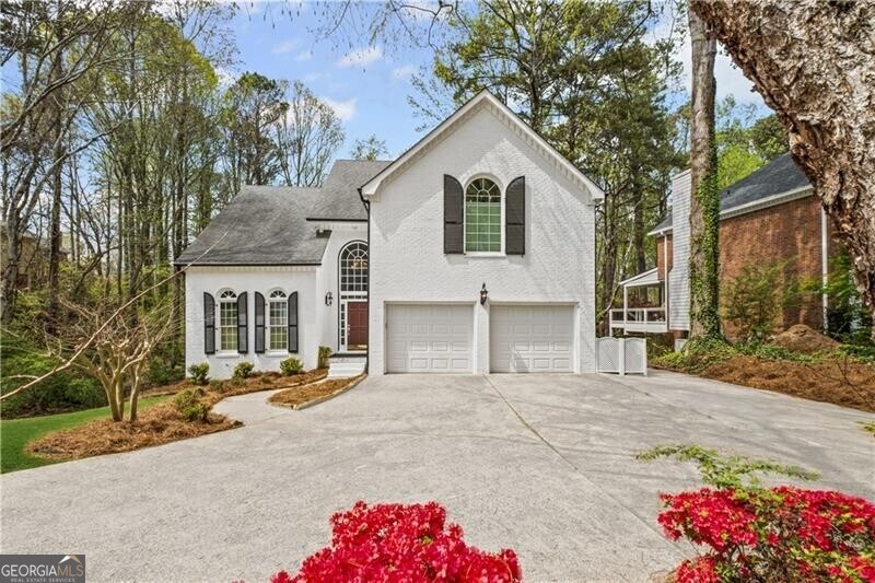 view of front of home featuring concrete driveway and a garage