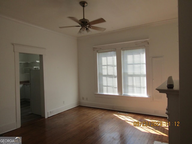 unfurnished bedroom featuring crown molding, baseboards, visible vents, ceiling fan, and wood finished floors