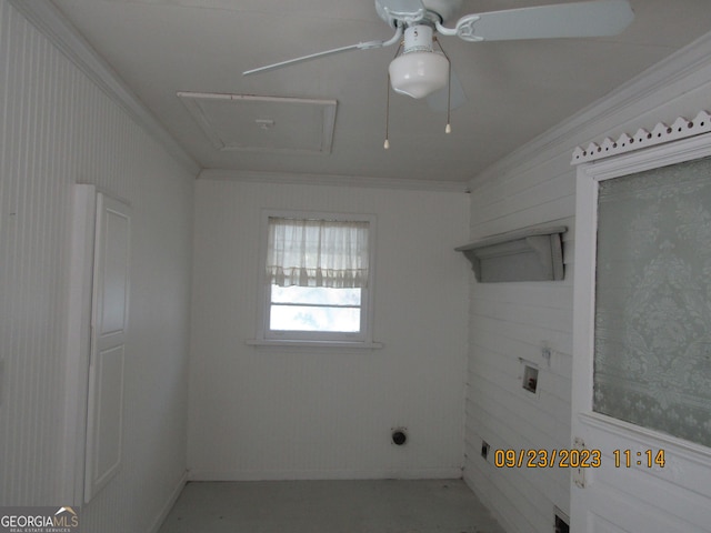 spare room featuring a ceiling fan, crown molding, and attic access