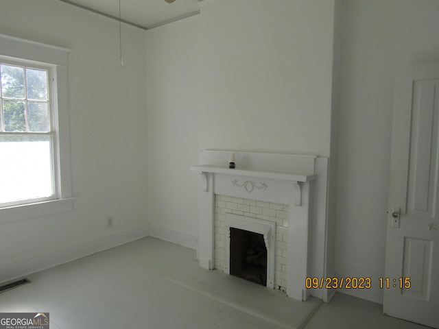 unfurnished living room with a fireplace and visible vents