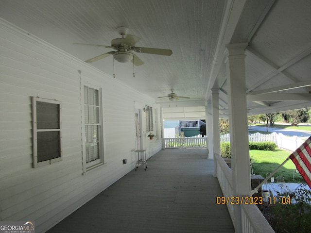 view of patio with fence and a ceiling fan