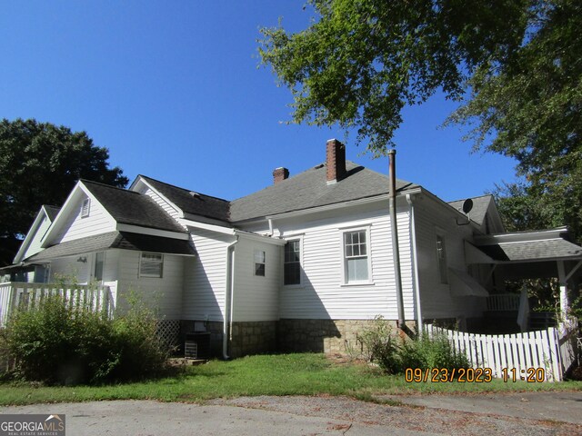 view of side of property featuring a chimney