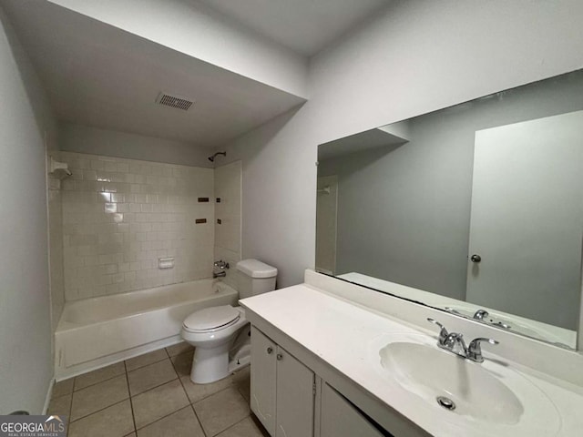half bath with tile patterned floors, toilet, baseboards, and vanity