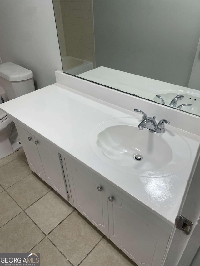 bathroom featuring a washtub, tile patterned flooring, vanity, and walk in shower
