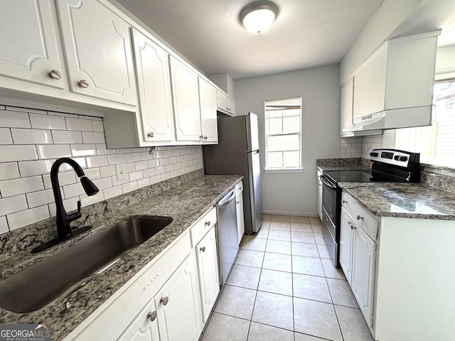 spare room with visible vents, wood finished floors, stairway, and a ceiling fan