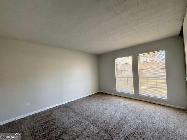 unfurnished bedroom with baseboards, carpet, a closet, and visible vents