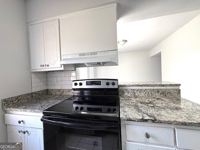 room details with white cabinets, a sink, stone counters, and backsplash