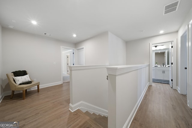 807 Stickley Oak Way, Woodstock, GA 30189 - hall with an upstairs landing, visible vents, recessed lighting, and light wood finished floors